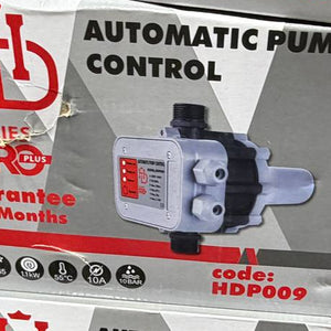 Boxes of automatic pump controls with visible branding on a surface.